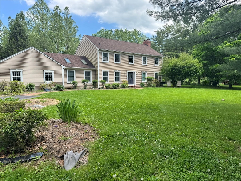 150 Cedar Ave, Poughkeepsie, NY 12603 - colonial inspired home featuring a chimney and a front lawn