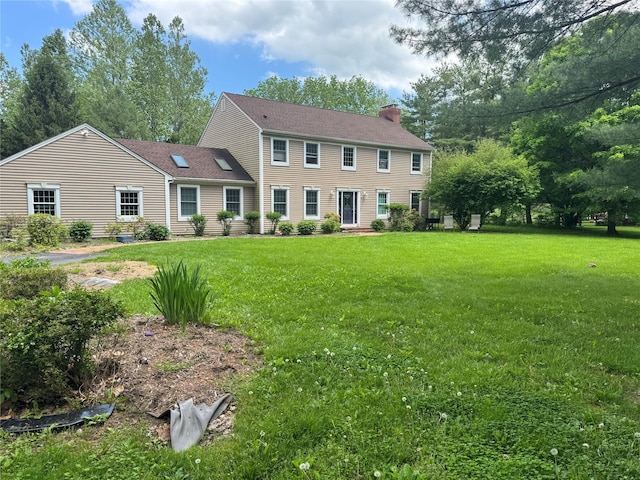 150 Cedar Ave, Poughkeepsie, NY 12603 - colonial inspired home featuring a chimney and a front lawn