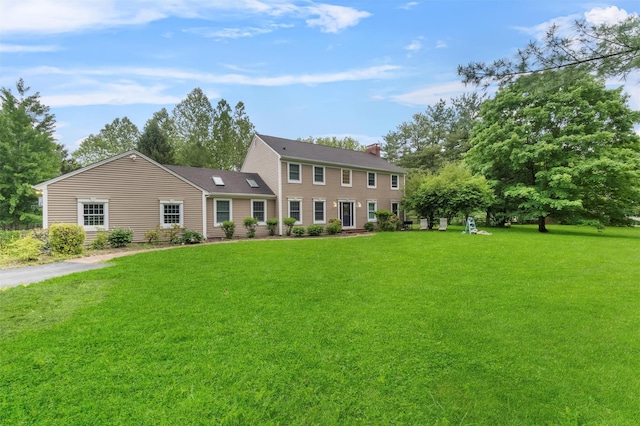150 Cedar Ave, Poughkeepsie, NY 12603 - colonial house with a front lawn and a chimney