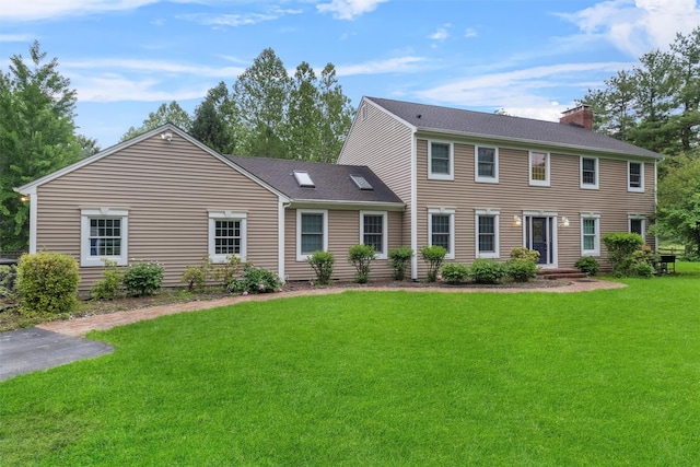 150 Cedar Ave, Poughkeepsie, NY 12603 - colonial inspired home featuring a chimney, a front lawn, and a shingled roof