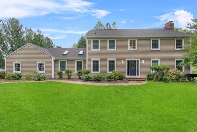 150 Cedar Ave, Poughkeepsie, NY 12603 - colonial-style house with a chimney and a front lawn