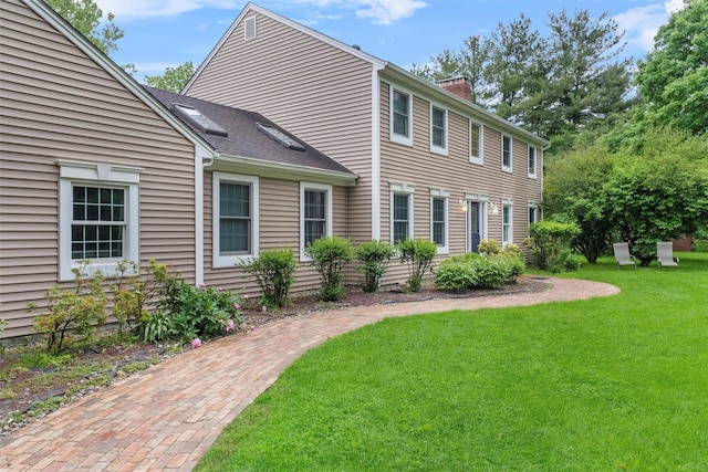 150 Cedar Ave, Poughkeepsie, NY 12603 - view of front of house with a chimney and a front yard