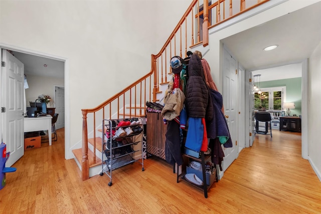 150 Cedar Ave, Poughkeepsie, NY 12603 - stairs with wood finished floors and a towering ceiling