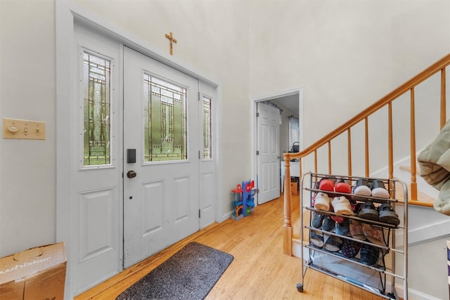 150 Cedar Ave, Poughkeepsie, NY 12603 - foyer entrance with light wood finished floors and stairs