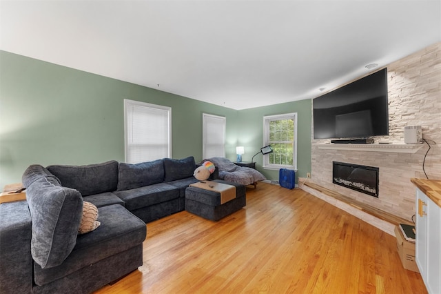 150 Cedar Ave, Poughkeepsie, NY 12603 - living room featuring a fireplace and light wood finished floors