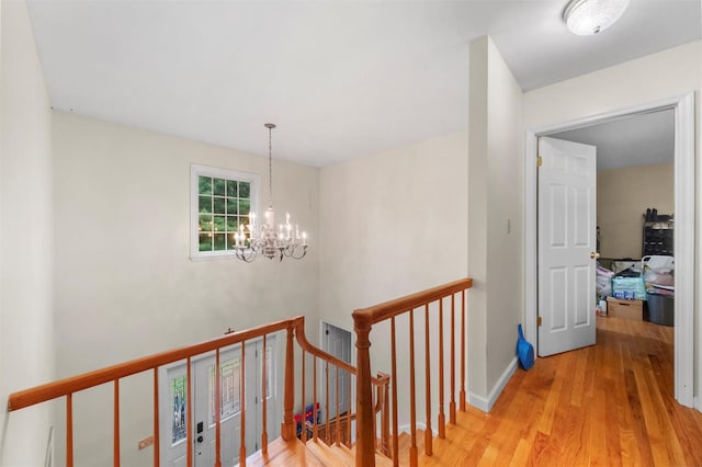 150 Cedar Ave, Poughkeepsie, NY 12603 - corridor featuring an upstairs landing, a chandelier, wood finished floors, and baseboards
