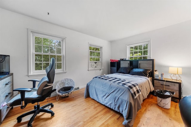 150 Cedar Ave, Poughkeepsie, NY 12603 - bedroom featuring wood finished floors and an office area