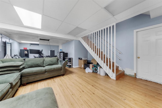 150 Cedar Ave, Poughkeepsie, NY 12603 - living room featuring wood finished floors, stairway, and a paneled ceiling