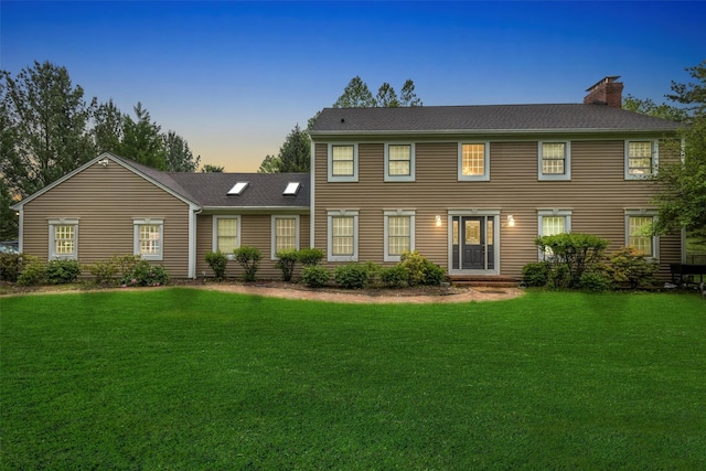 150 Cedar Ave, Poughkeepsie, NY 12603 - colonial-style house featuring a chimney and a yard