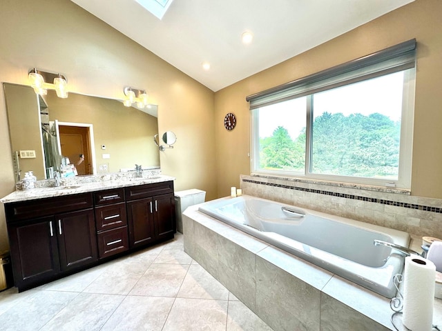 9 Hill And Tree Ct, Melville, NY 11747 - bathroom with vaulted ceiling, double vanity, a garden tub, tile patterned floors, and a skylight