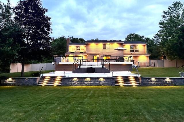 9 Hill And Tree Ct, Melville, NY 11747 - back of property with stairway, a deck, and a chimney