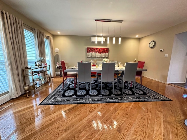 9 Hill And Tree Ct, Melville, NY 11747 - dining room featuring wood finished floors, baseboards, and recessed lighting