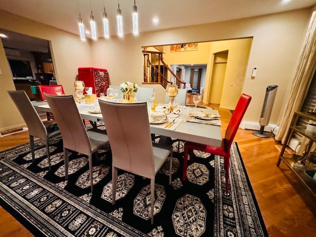 9 Hill And Tree Ct, Melville, NY 11747 - dining space featuring wood finished floors, stairs, baseboards, and recessed lighting