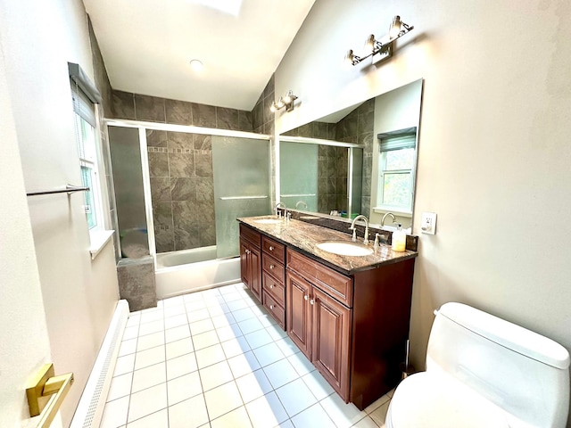9 Hill And Tree Ct, Melville, NY 11747 - bathroom with toilet, tile patterned floors, double vanity, and bath / shower combo with glass door