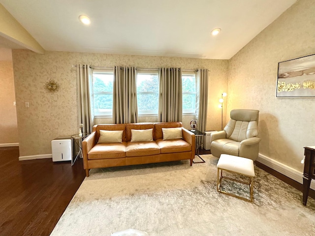 9 Hill And Tree Ct, Melville, NY 11747 - living room with wood finished floors, vaulted ceiling, healthy amount of natural light, baseboards, and recessed lighting