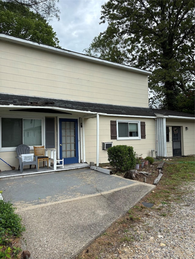 109 Convent Rd, Syosset, NY 11791 - rear view of house with a porch and roof with shingles