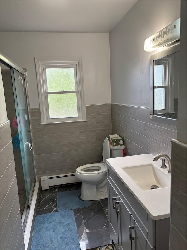 109 Convent Rd, Syosset, NY 11791 - bathroom featuring tile walls, a baseboard radiator, wainscoting, a shower stall, and vanity