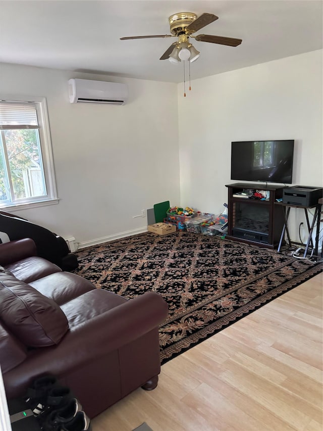 109 Convent Rd, Syosset, NY 11791 - living room featuring a wall unit AC, wood finished floors, and a ceiling fan