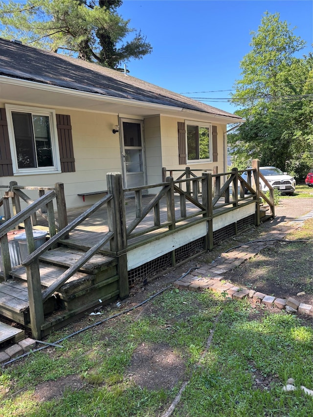 109 Convent Rd, Syosset, NY 11791 - property entrance featuring roof with shingles and a wooden deck