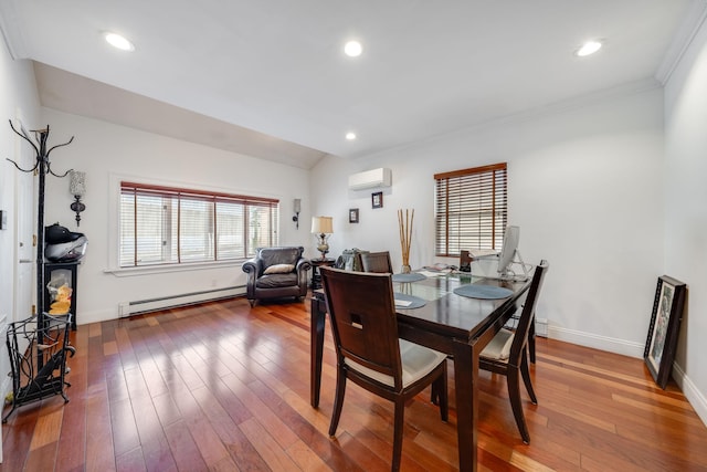 dining room featuring baseboard heating, a wall mounted air conditioner, wood-type flooring, baseboards, and ornamental molding