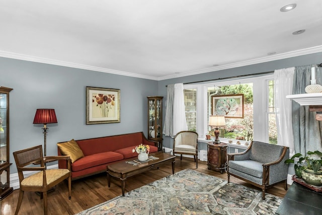 living area with ornamental molding, wood finished floors, and recessed lighting