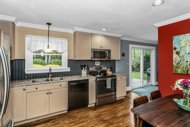 kitchen featuring stainless steel appliances, a sink, crown molding, dark wood-style floors, and light stone counters