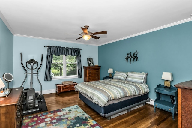 bedroom featuring wood finished floors, crown molding, baseboards, and ceiling fan
