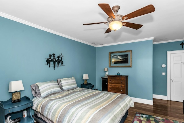 bedroom with ornamental molding, baseboards, wood finished floors, and ceiling fan