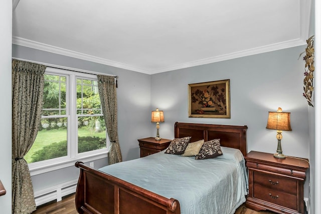 bedroom with a baseboard radiator, ornamental molding, and wood finished floors
