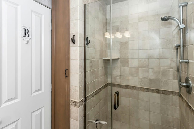 full bath with a shower stall