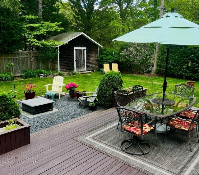13 Delacey Ave, East Quogue, NY 11942 - wooden terrace featuring outdoor dining space