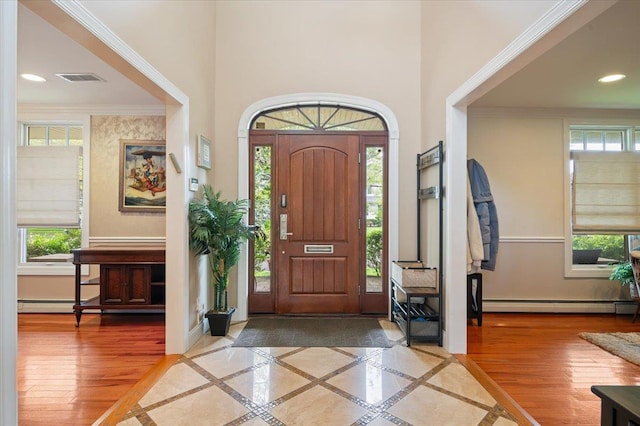 525 Green Pl, Woodmere, NY 11598 - foyer with a baseboard heating unit, inlaid floor details, plenty of natural light, a towering ceiling, and recessed lighting