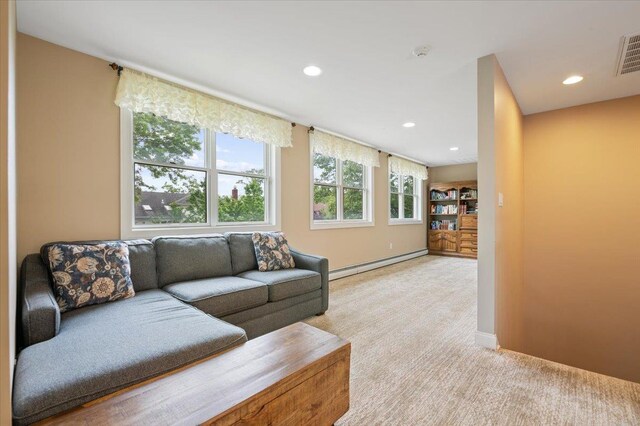 525 Green Pl, Woodmere, NY 11598 - living room featuring a baseboard heating unit, light carpet, recessed lighting, and baseboards