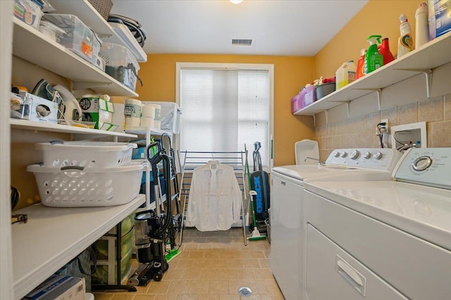 525 Green Pl, Woodmere, NY 11598 - washroom with independent washer and dryer and light tile patterned floors
