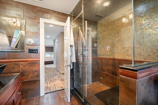 525 Green Pl, Woodmere, NY 11598 - bathroom with tile walls, vanity, a shower stall, tile patterned flooring, and recessed lighting
