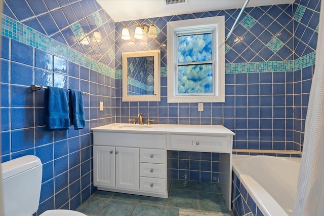 525 Green Pl, Woodmere, NY 11598 - full bathroom featuring tile walls, vanity, toilet, and tile patterned floors