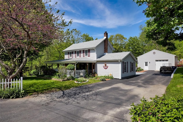 3 Rock Pl, Stanfordville, NY 12581 - view of front of house featuring an outdoor structure, a chimney, a garage, a porch, and asphalt driveway