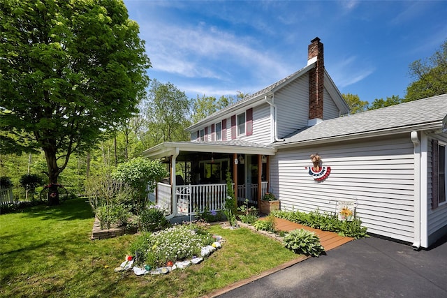 3 Rock Pl, Stanfordville, NY 12581 - view of side of home with a lawn, covered porch, a chimney, and a shingled roof