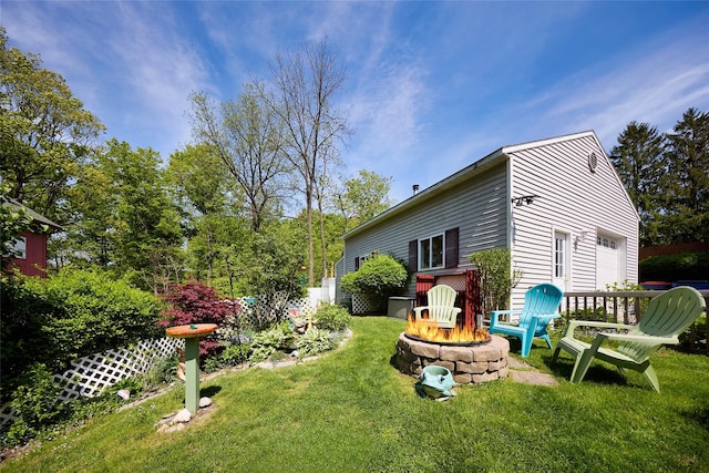 3 Rock Pl, Stanfordville, NY 12581 - view of green lawn with an outdoor fire pit and a garage