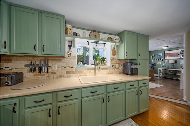 3 Rock Pl, Stanfordville, NY 12581 - kitchen featuring a sink, green cabinetry, light countertops, and decorative backsplash