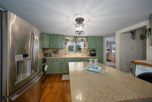 3 Rock Pl, Stanfordville, NY 12581 - kitchen featuring green cabinetry, appliances with stainless steel finishes, backsplash, and wood finished floors