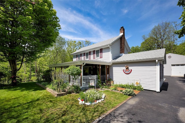 3 Rock Pl, Stanfordville, NY 12581 - view of front of house featuring a front yard, a chimney, roof with shingles, covered porch, and driveway