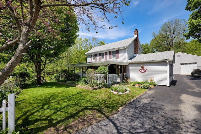 3 Rock Pl, Stanfordville, NY 12581 - view of front of property with asphalt driveway, a chimney, a front yard, a porch, and a shingled roof