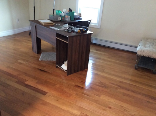 114-30 158th St, Jamaica, NY 11434 - office area featuring a baseboard heating unit, light wood-type flooring, and baseboards