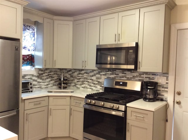 114-30 158th St, Jamaica, NY 11434 - kitchen with stainless steel appliances, a sink, light countertops, and decorative backsplash