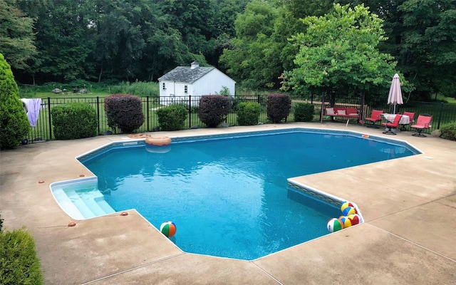 395 Toleman Rd, Washingtonville, NY 12575 - view of swimming pool featuring a patio area and a wooded view