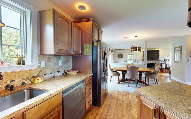 395 Toleman Rd, Washingtonville, NY 12575 - kitchen featuring stainless steel appliances, a sink, light wood-type flooring, and light stone counters