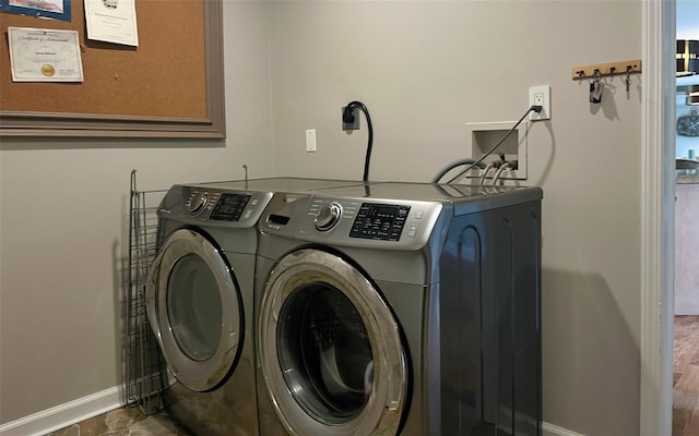 395 Toleman Rd, Washingtonville, NY 12575 - laundry area featuring washing machine and clothes dryer and baseboards