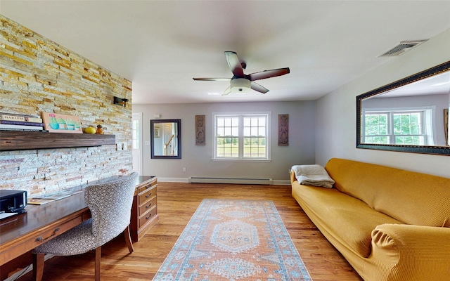 395 Toleman Rd, Washingtonville, NY 12575 - living area with a baseboard radiator, light wood-style flooring, ceiling fan, and baseboards