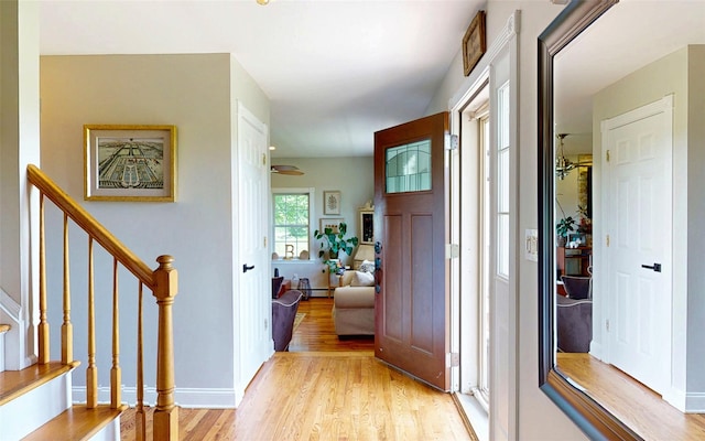 395 Toleman Rd, Washingtonville, NY 12575 - corridor with light wood-type flooring, stairway, and baseboards